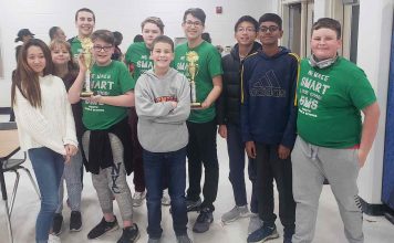 The academic team at J.C. Booth Middle show off their trophies after winning the Middle School Academic Bowl with an undefeated season. Photo/Fayette County School System.