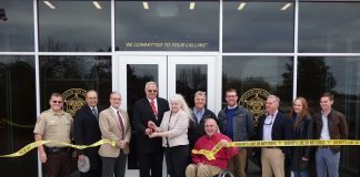 Present for the Dec. 12 ribbon cutting at the new Fayette County Sheriff’s Office Shooting Range and Training Center on Hewell Road were, from left, Capt. Troy McCollum, Fayetteville Councilman Paul Oddo, Fayette County Commissioner Chuck Oddo, Fayette County Commission Chairman Randy Ognio, Maj. Michelle Walker, Fayette County Administrator Steve Rapson, Fayette County Commissioner Eric Maxwell, Project Manager Tim Symonds, K.A. Oldham Design representatives Kip Oldman and Lynda Alexander and Oak Construction representative Hampton Vann. Photo/Ben Nelms.
