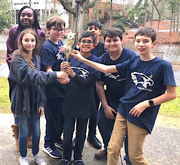 <b>Flat Rock Middle scored enough points at the FIRST LEGO League Super Regional competition to earn a spot in the state championship. Team members (L-R) Madison Lohr, Jya Lee, Gavin McClure, Devon Nandlal, Darion Nandlal, Jaden Torres, and Jack Jung. Not pictured: Melissa Lohr, coach, and Darryl Hutchinson, co-coach. Photo/Fayette County School System.</b>