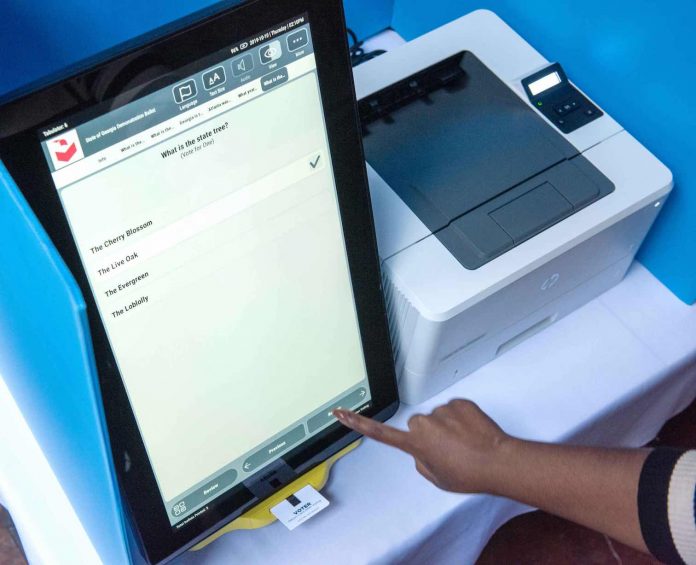 Georgia voter makes a selection in a test of the state's new voting machines. Photo/Ga. Secretary of State.