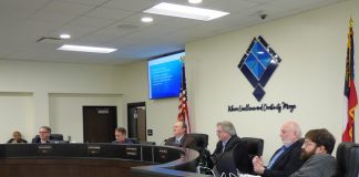 Members of the Fayette County Board of Education at the March 9 work session included, from left, board members Brian Anderson and Barry Marchman, Superintendent Jody Barrow, Chairman Scott Hollowell and board members Roy Rabold and Leonard Presberg. Photo/Ben Nelms.