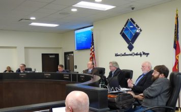 Members of the Fayette County Board of Education at the March 9 work session included, from left, board members Brian Anderson and Barry Marchman, Superintendent Jody Barrow, Chairman Scott Hollowell and board members Roy Rabold and Leonard Presberg. Photo/Ben Nelms.