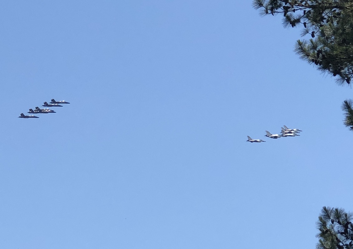 Still in tight formation, the U.S. Navy Blue Angels and U.S. Air Force Thunderbirds head down Ga. Highway 54 toward Peachtree City and later Piedmont Newnan Hospital in Coweta County. The pilots had just finished their flyover of crowds outside Piedmont Fayette Hospital. Photo/Cal Beverly.