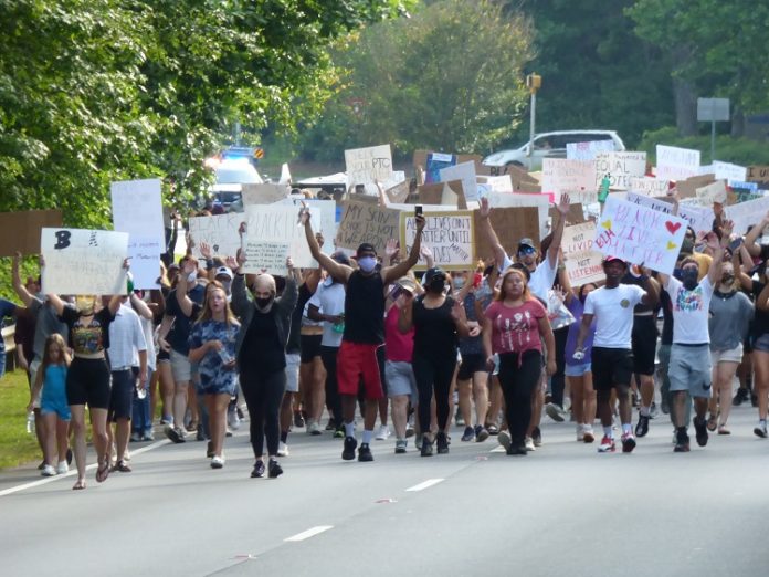 A group of 400 people protesting the loss of black lives to law enforcement marched along Ga. Highway 54 in Peachtree City during the afternoon hours of June. 2. The peaceful protest began at The Avenue and ended at City Hall Plaza. Photo/Ben Nelms.