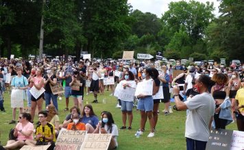 The photo above shows a portion of the group of 600 people who arrived at Drake Field in Peachtree City on June 7 to attend a protest initiated by McIntosh High School rising sophomore Kaitlyn Hood. The aim of the protest was to bring awareness to the black lives lost in encounters with law enforcement. Photo/Ben Nelms.