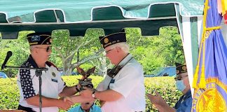 New Post 50 Commander Mark Gelhardt presents an eagle statue to the outgoing Commander Leigh Blood. Photo/Submitted.
