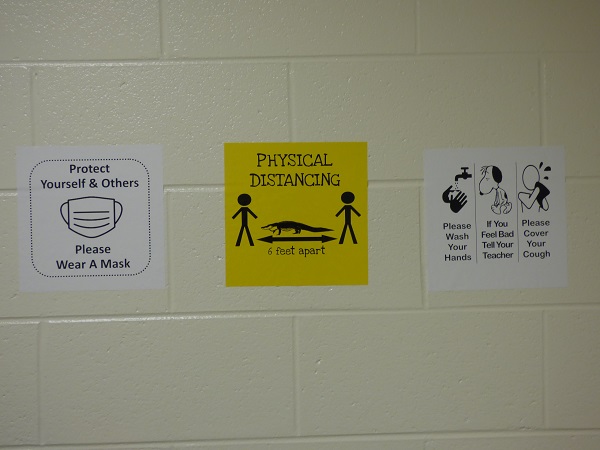 <b>Signs in Fayette County public school hallways will display health and safety precautions. Photo/Ben Nelms.</b>