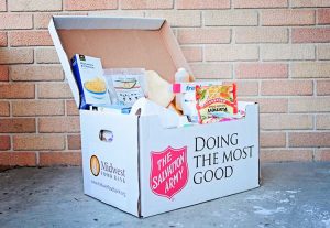 <b>An open box filled with food and other disaster relief supplies packed by Midwest Food Bank in Peachtree City. Photo/Midwest Food Bank.</b>