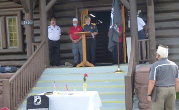 A group of veterans from around Fayette County met Sept. 18 at the American Legion Log Cabin in Fayetteville for the annual POW/MIA Recognition Day, in the hope that people of this nation will "Never Forget" the service and sacrifice of those who never retuned home. Photo/Ben Nelms.