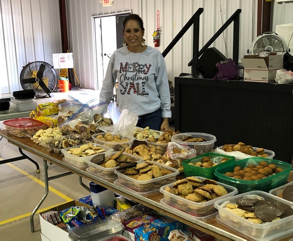 <b>Tyrone resident Theresa Clay five years ago began baking Christmas goodies and sending them to troops overseas. Her effort has blossomed as word spread through the community. Photo/Submitted.</b>