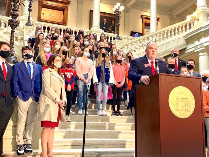 Dozens of student athletes in Georgia girls’ sports joined state Rep. Phillip Singleton (at podium) to support his bill banning transgender participation on Feb. 4, 2021. Photo/Beau Evans of Capitol Beat.