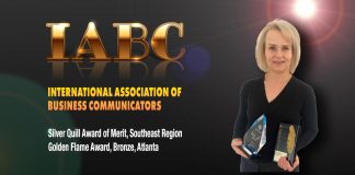 Fayette County School System Public Information Officer Melinda Berry-Dreisbach holds the IABC award. Photo/Fayette County School System.