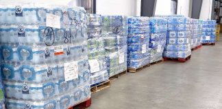 Pallets of drinking water await loading for ship to texas from the Midwest Food Bank warehouse in Peachtree City. Photo/Midwest Food Bank.