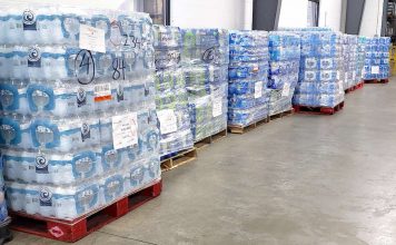 Pallets of drinking water await loading for ship to texas from the Midwest Food Bank warehouse in Peachtree City. Photo/Midwest Food Bank.