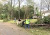 Members of the all-volunteer CERT team from the Peachtree City Police Department help clean up at one tornado-damaged home.