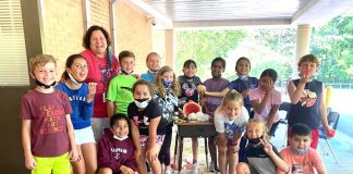 Shawn Agur’s 3rd grade class enjoys their science experiment and snacks on some watermelon, too. Photo/Fayette County School System.
