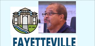 Fayetteville Mayor Ed Johnson with city's logos,