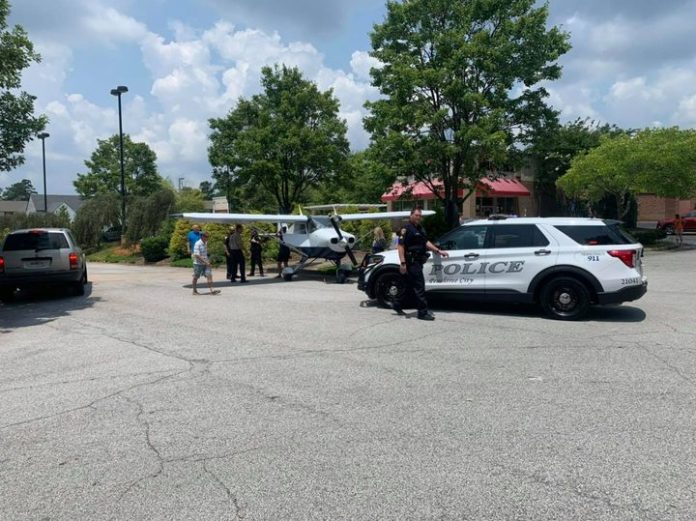 Peachtree City Police on scene of forced landing of aircraft on Hwy 54 East at Publix_E