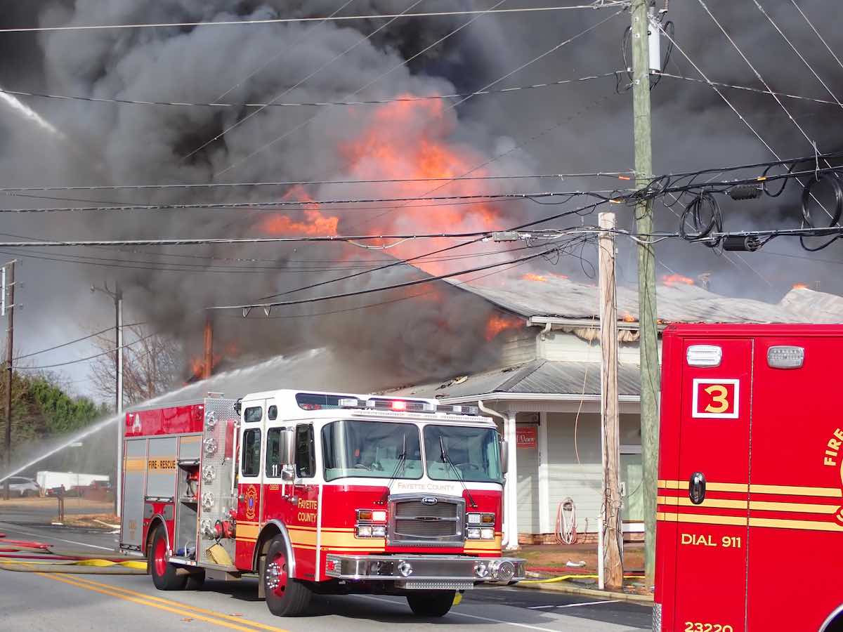 Flames engulf Tyrone business on Senoia Road Wednesday. The building was destroyed. Photo/Fayette County Fire Dept.