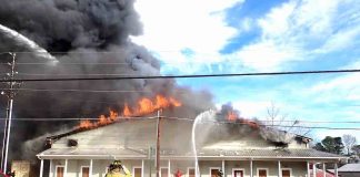 Flames engulf building containing consignment shop on Senoia Road in Tyrone Wednesday. Photo/Fayette County Fire Dept.