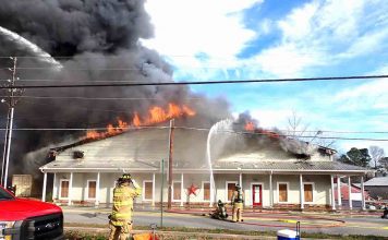 Flames engulf building containing consignment shop on Senoia Road in Tyrone Wednesday. Photo/Fayette County Fire Dept.