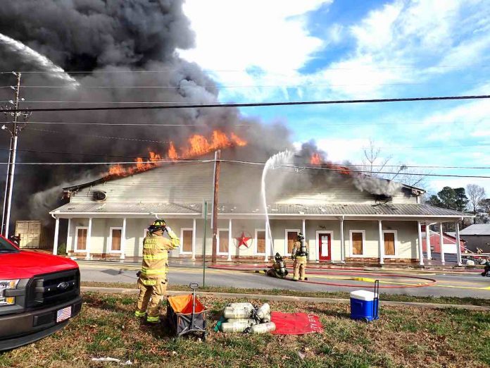 Flames engulf building containing consignment shop on Senoia Road in Tyrone Wednesday. Photo/Fayette County Fire Dept.