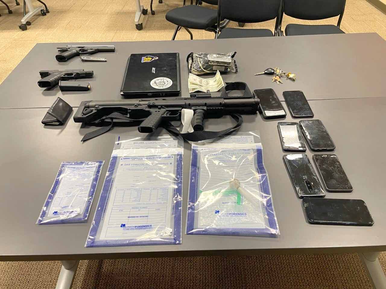 Guns, phones and drugs were found in the vehicle of a Palmetto man during a Feb. 19 traffic stop in Peachtree City. Photo/Peachtree City Police Department.