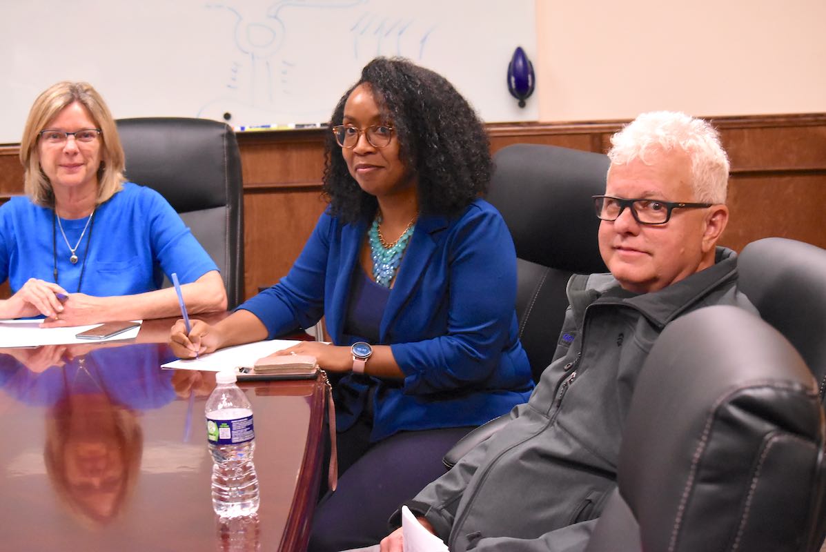 Following an executive session to finalize details of the offer to an interim city manager, Mayor Kim Learnard (L), City Clerk Yasmin Julio and Councilman Phil Prebor answer questions in City Hall. Photo/Cal Beverly.