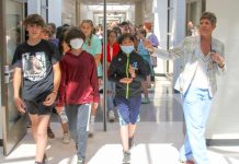 Principal Deb Troutman leads current and future Booth Middle School into their new school during a tour last week. Photo/Fayette County School System.