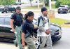 Douglasville resident Steven Andre Beacham (right) is in custody for the May 25 murder of Jabrell Jerome Buggs, of Atlanta, at a south Fayette County residence. Accompanying Beacham is Fayette County Sheriff's Office Investigator Marlyn Willilams (left) and Investigator and Case Agent in-charge Taweyla Wilson. Photo/Fayette County Sheriff's Office.