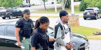Douglasville resident Steven Andre Beacham (right) is in custody for the May 25 murder of Jabrell Jerome Buggs, of Atlanta, at a south Fayette County residence. Accompanying Beacham is Fayette County Sheriff's Office Investigator Marlyn Willilams (left) and Investigator and Case Agent in-charge Taweyla Wilson. Photo/Fayette County Sheriff's Office.