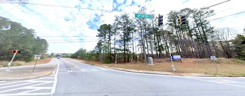 Looking northeast from the intersection of Ga. Highway 54 West and Sandy Creek Road South. Street view.