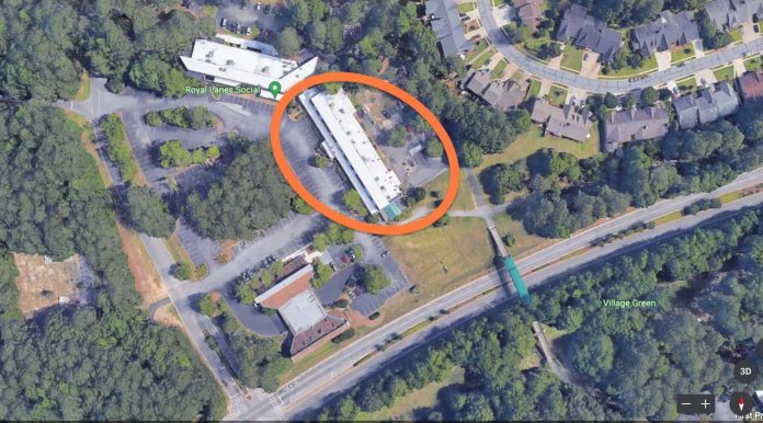 A Google Earth top-down view of Aberdeen Village Center with north at top shows the building (circled) to be demolished and rebuilt as a 3-story period brick structure containing retail on the ground floor and residential condos on the second- and third-floors.