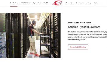 A data center employee checks a bank of servers in a routine maintenance operation. Photo/QTS website.