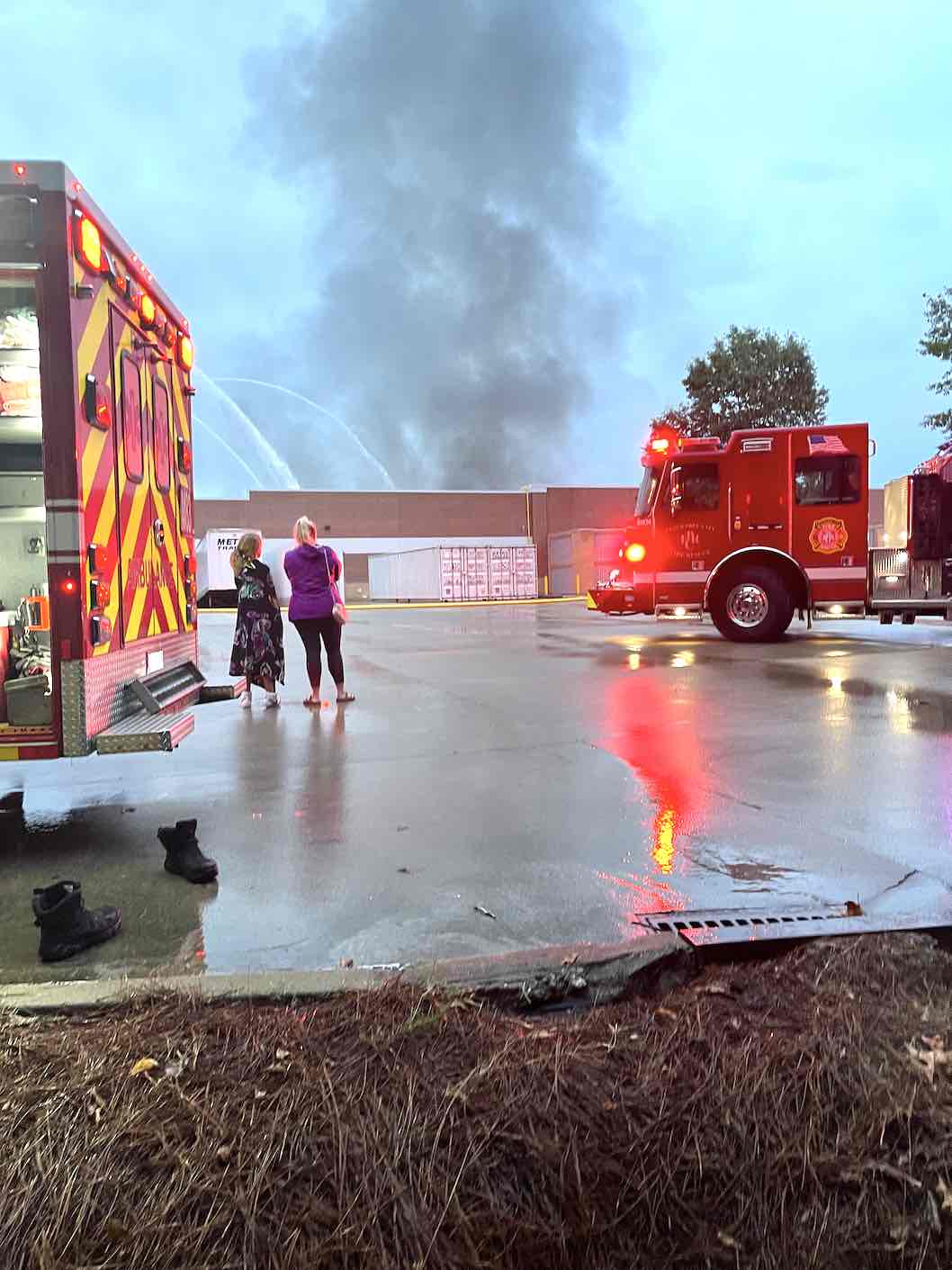Firefighters begin to get the better of the suspicious blaze at the Peachtree City Walmart. Photo by Carol Kurpiel.