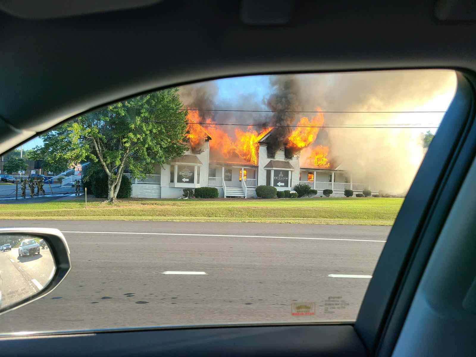 The old home that for years housed antiques for sale, a tea room and gifts and known as Collectors Corner was severely damaged by a Wednesday evening fire, as shown in this photo taken from a passing car. Photo/Ryan Jolly.