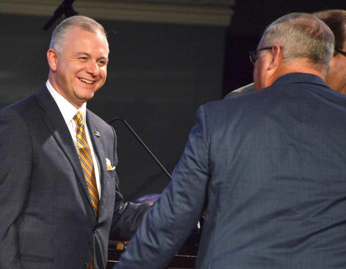Newly elected president Josh Saefkow walks off the stage after his election as president was announced by outgoing president Kevin Williams, right, at the 200th annual meeting of the Georgia Baptist Convention in Augusta, Ga, Tuesday, Nov. 15, 2022. Photo/Index/Henry Durand.