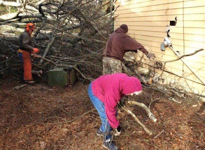 Volunteers from Georgia Baptist Disaster Relief remove storm debris from a home in Griffin. Tornadoes caused damage across much of the state last week. Photo/The Christian Index.