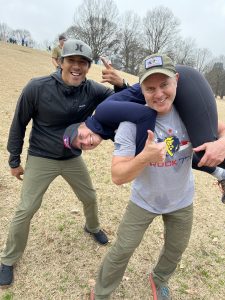 GORUCK Trailblazer event - Joe Domaleski does a one-man fireman's carry of his wife Mary Catherine up a hill at Piedmont Park as GORUCK Cadre JC Jordan looks on. Photo/Joe Domaleski