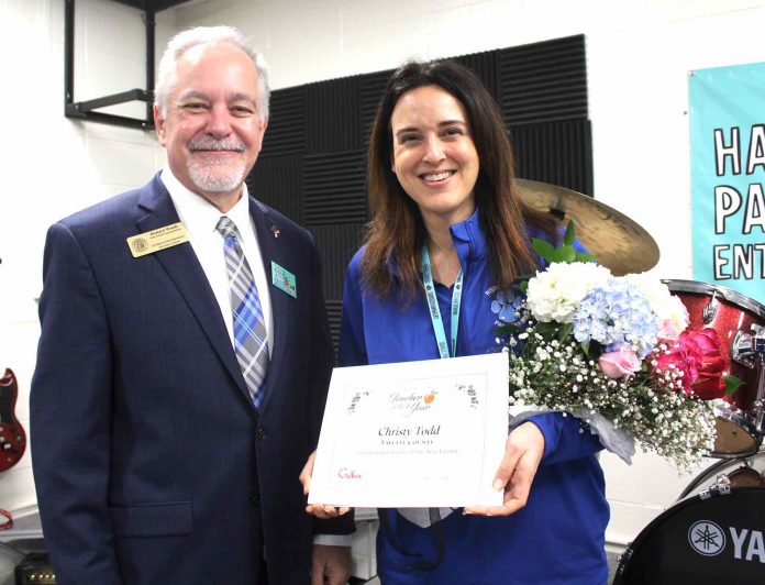 State School Superintendent Richard Woods presents Christy Todd, a music technology teacher at Rising Starr Middle, with a certificate naming her one of 10 finalists for Georgia Teacher of the Year. Photo/Fayette County School System.