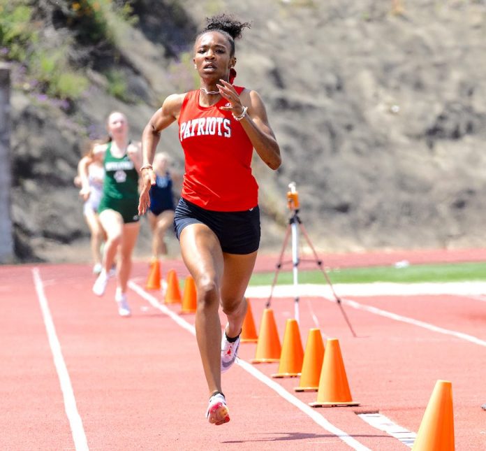 Sandy Creek High School senior Isis Simone Grant on her record-setting pace to become the fastest 800-meter female runner in the history of Georgia track records. Photos/Atlanta Track Club.