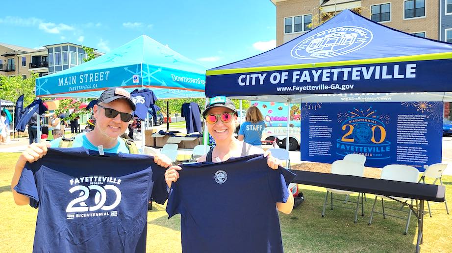 Joe and Mary Catherine Domaleski display Bicentennial shirts honoring Fayetteville's 200 birthday since its founding. Photo/City of Fayetteville Facebook page.