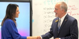 Christy Todd (L) is congratulated in April after her selection as Fayette County's Teacher of the Year by Georgia School Superintendent Richard Woods. Photo/Ga. Dept. of Education.