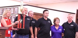 Mayor Kim Learnard presents top award to A Better Way Ministries representatives at the City Council meeting July 13. The group won the Grand Marshal Trophy for the 4th of July Parade. Photo/Cal Beverly.