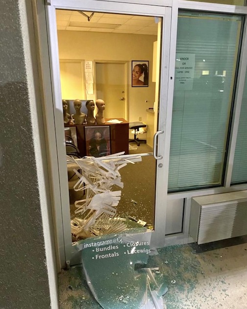 Smashed front door of business burglarized by 3 suspects Aug. 4. Photo/Fayette County Sheriff's Office.