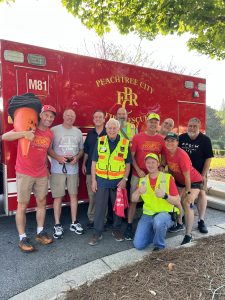 Members of the Fayette County Amateur Radio Emergency Services (ARES) provided support to the 2023 Tri-PTC Triathlon. Pictured here with Tri-PTC President Allen Leonard (on left). Photo/Kim Bramblett