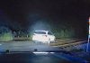 Police dash cam photo of a car parked on railroad tracks. Photo/Peachtree City Police Department.