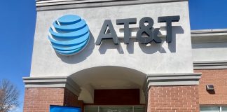 AT&T representatives are joined by Fayetteville Mayor Ed Johnson and Fayette County Chamber of Commerce CEO Leonardo McClarty for a ceremonial ribbon cutting at the AT&T store located at the Fayetteville Pavilion. Photo/Mary Elizabeth Roberson, AT&T