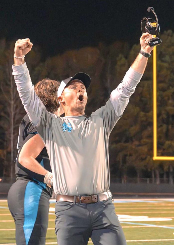 New head football coach David Cooper cheers on his team. Photo/Fayette County School System.