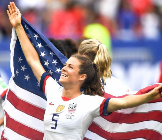 Kelley O'Hara flies the championship flag for her country. Photo/USSoccer.com